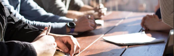 Photograph of hands while at a meeting